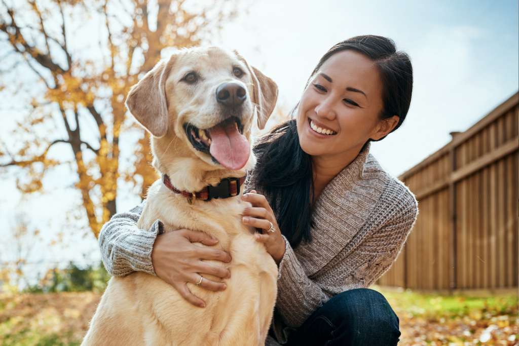 Happy dog owner with their pet